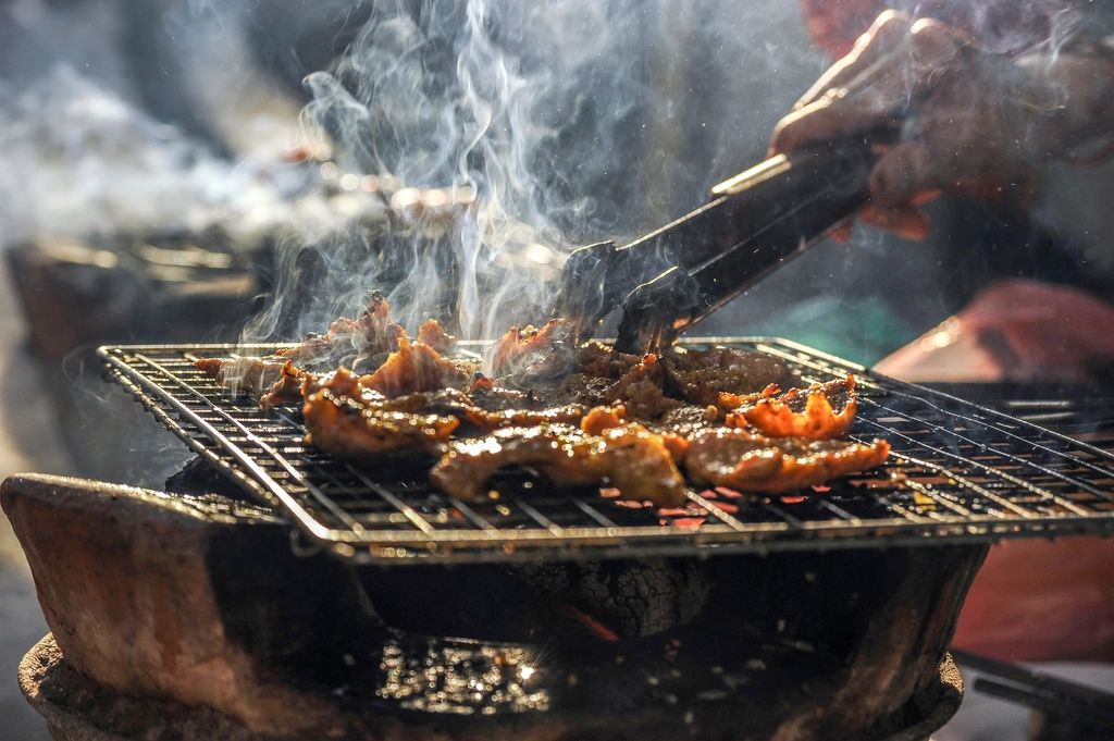 A cook working at the open kitchen
