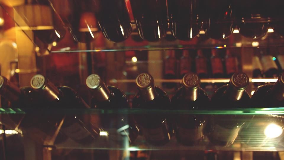 Wine glasses and bottles on the counter