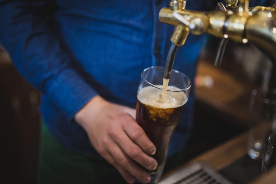 A cocktail being finished at the bar